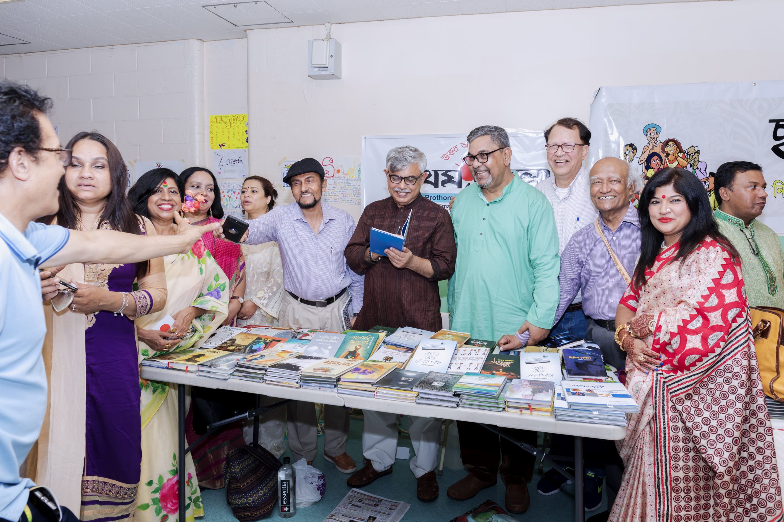 Writer Anisul Hoque among others at Prothom Alo North America Book Stall during the New York Bangla Boimela 2019